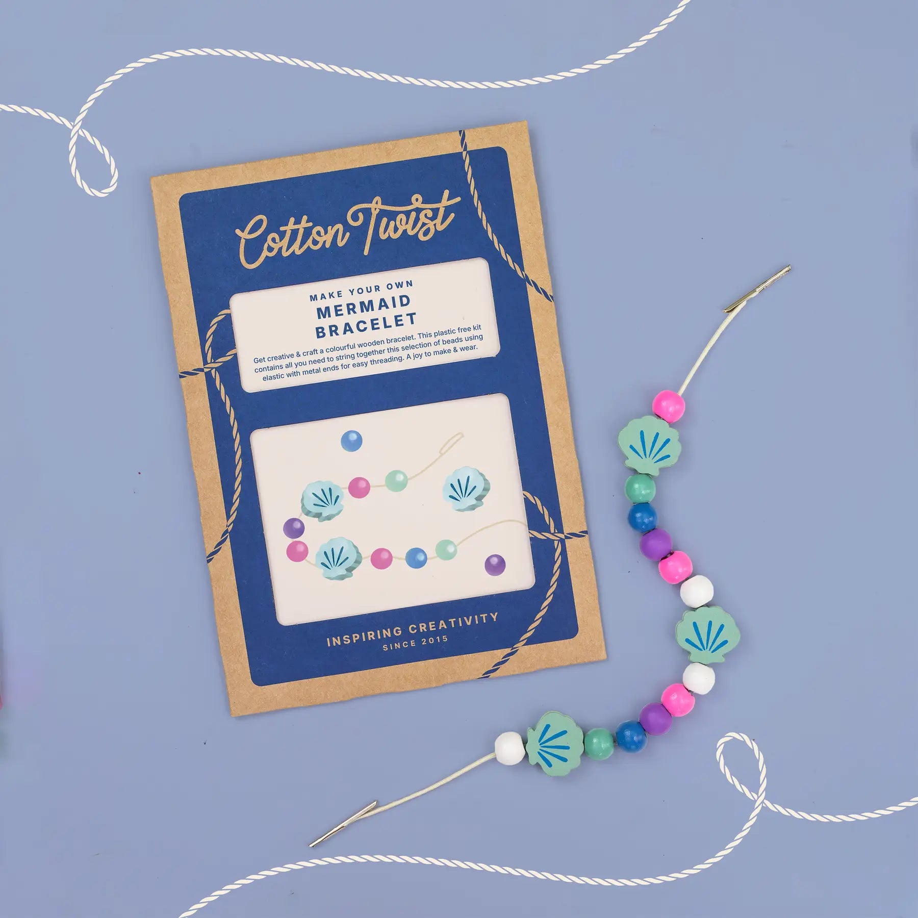 Mermaid bracelet kit with colorful beads and packaging on a blue background