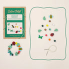 Cotton Twist mini beast bracelet kit with bracelet, beads, and instruction sheet on a white background