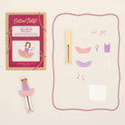 Ballerina peg doll set with packaging and accessories on a light beige background