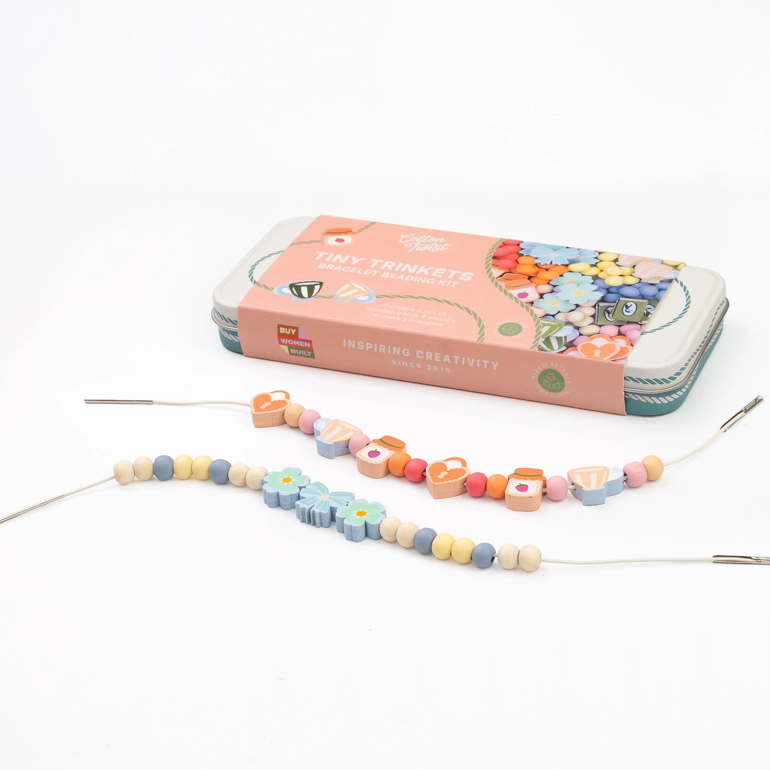 Colorful beaded jewelry making kit with a pink tin on a white background