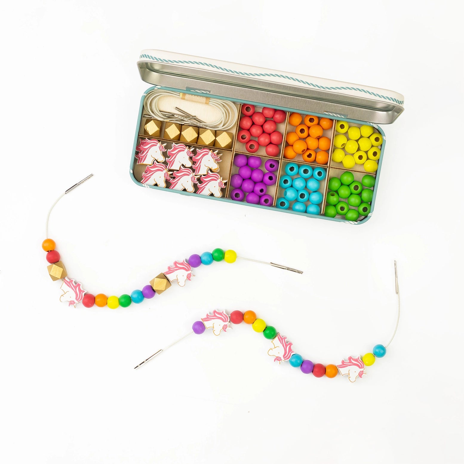 Colorful bead kit with a completed necklace on a white background