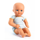 Baby doll wearing a checkered outfit on a white background
