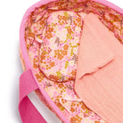 Pink floral-patterned bag with a pink strap on a white background