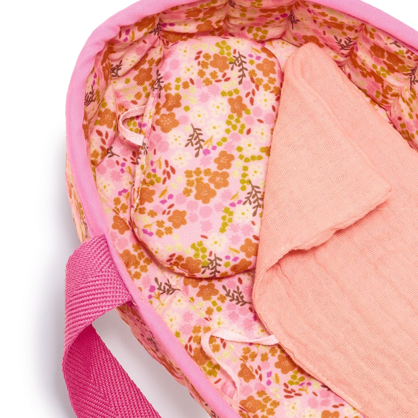 Pink floral-patterned bag with a pink strap on a white background