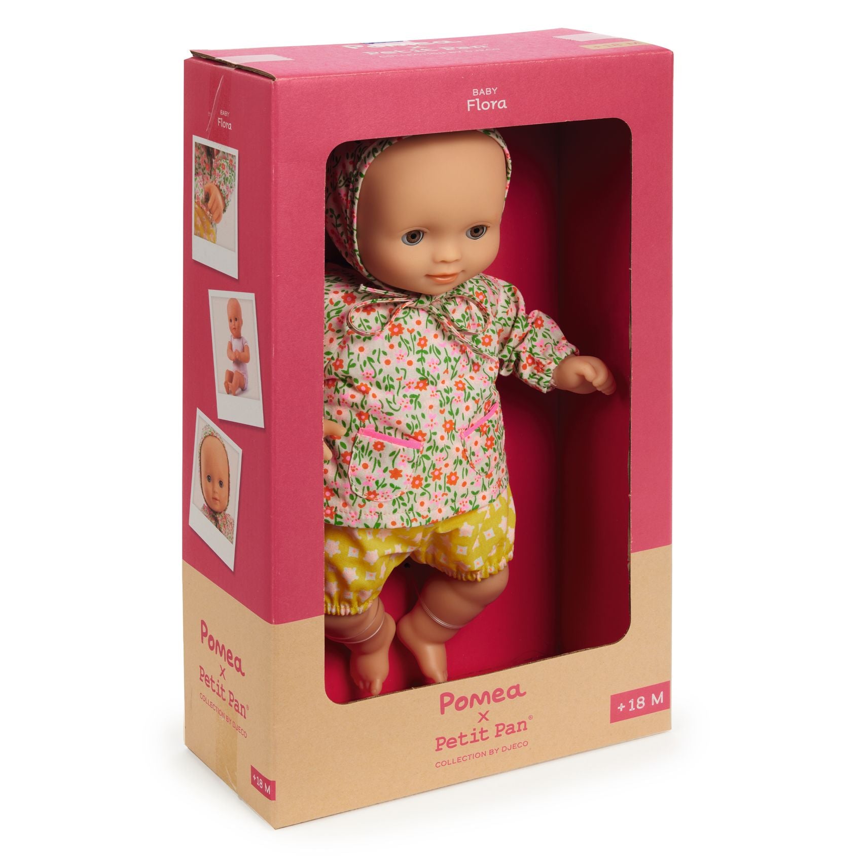 Baby doll in a pink and beige box with 'Petit Pan' branding