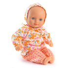 Doll wearing a floral outfit on a white background