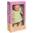 Pomea baby doll in a pink and beige box with images of the doll on the packaging.