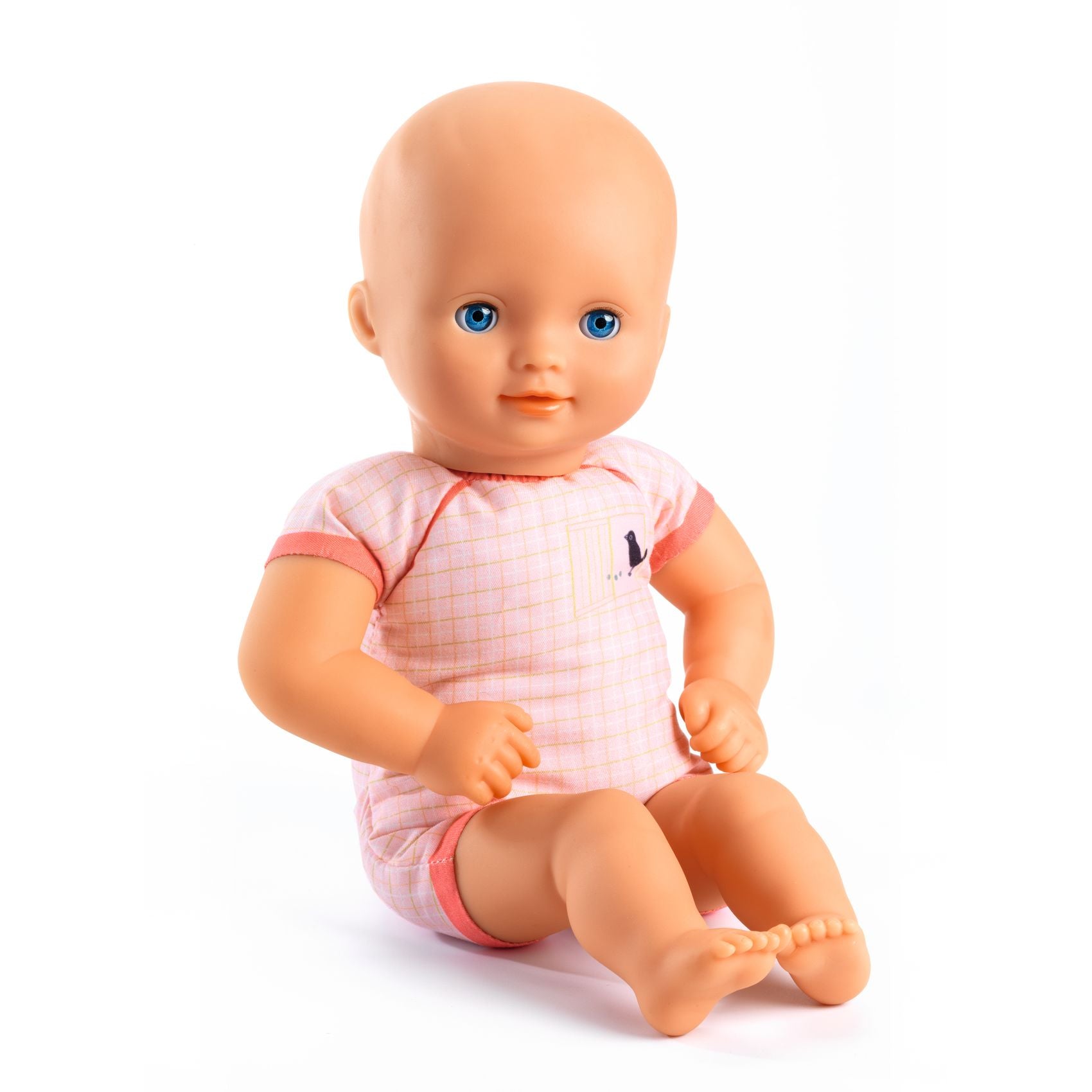 Baby doll with a pink outfit on a white background