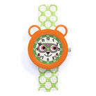 Children's watch with orange frame and green polka dot strap on a white background