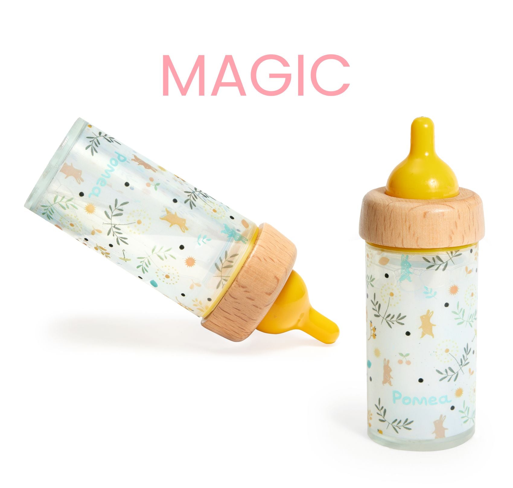Two baby bottles with wooden caps on a white background, one labeled 'MAGIC'.