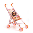 Toy stroller with a doll inside on a white background