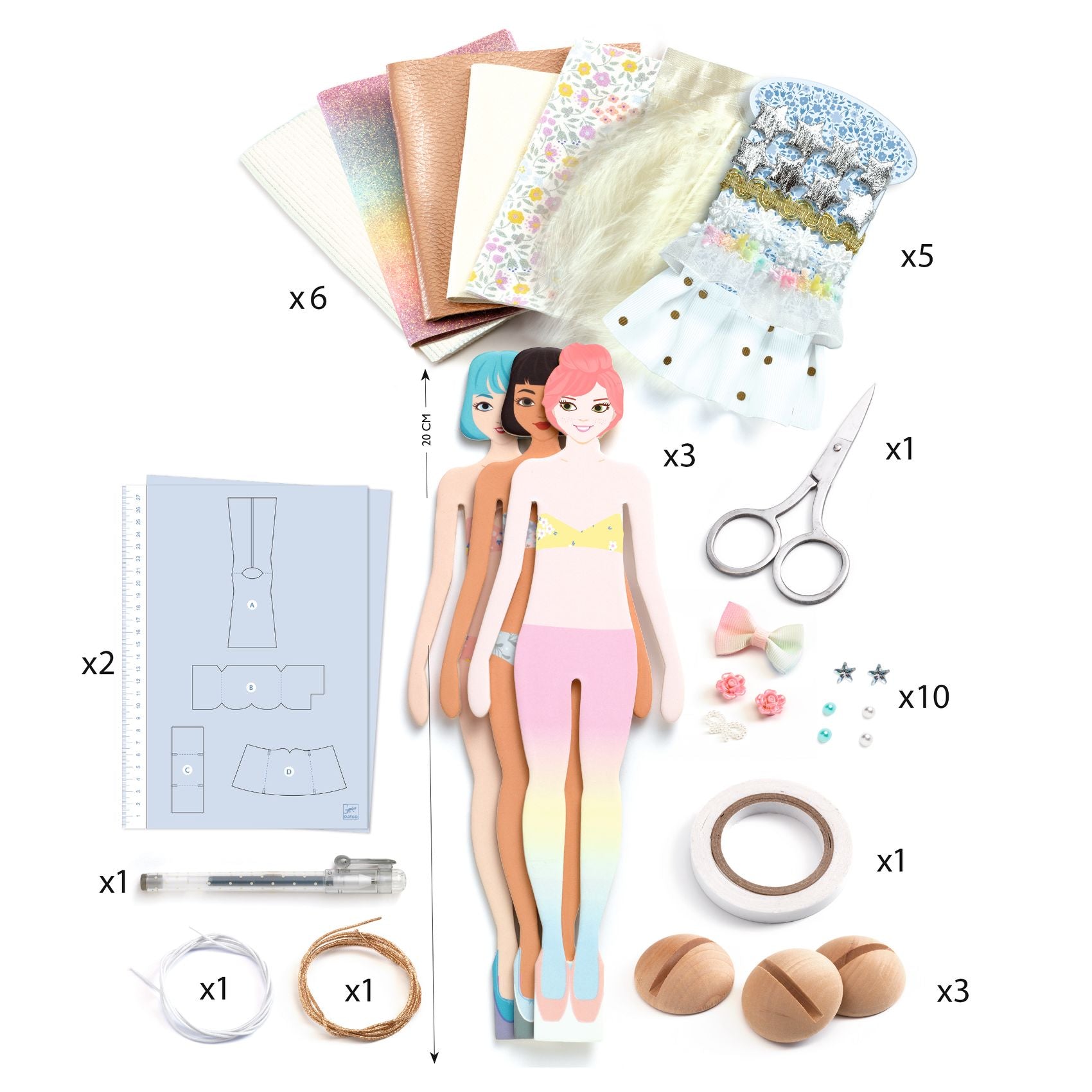 Collection of craft materials including paper dolls, patterns, scissors, and decorative items on a white background.