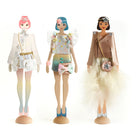 Three dolls with different outfits on a white background