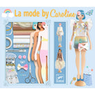 Doll and fashion accessories set with 'La mode by Caroline' branding on a blue background.