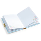 Open notebook with lined pages and decorative elements on a white background