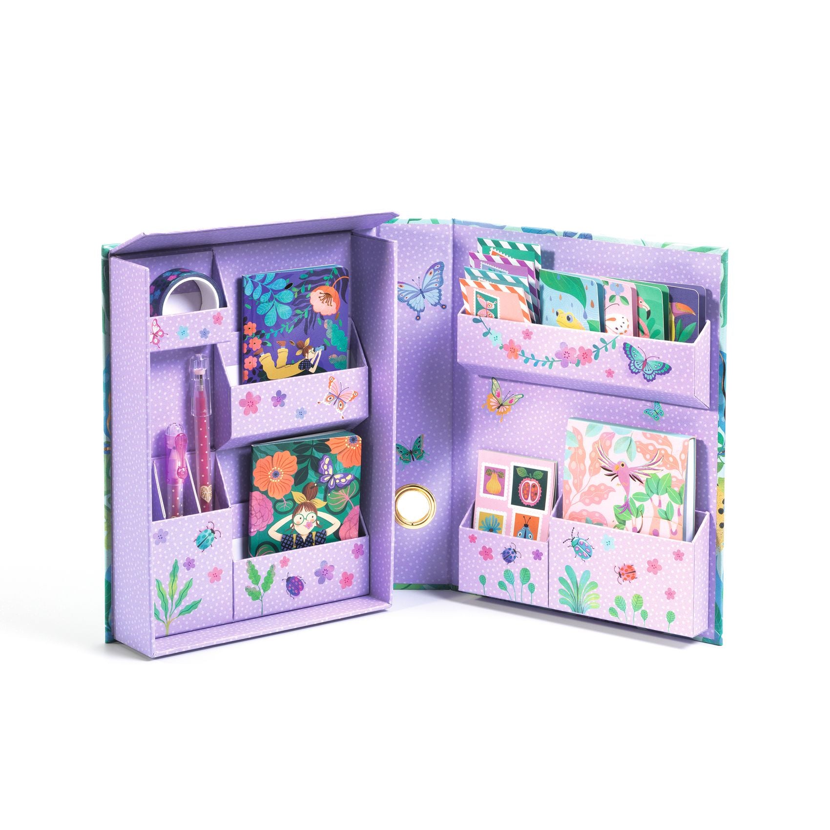 Open purple stationery set with various items on a white background