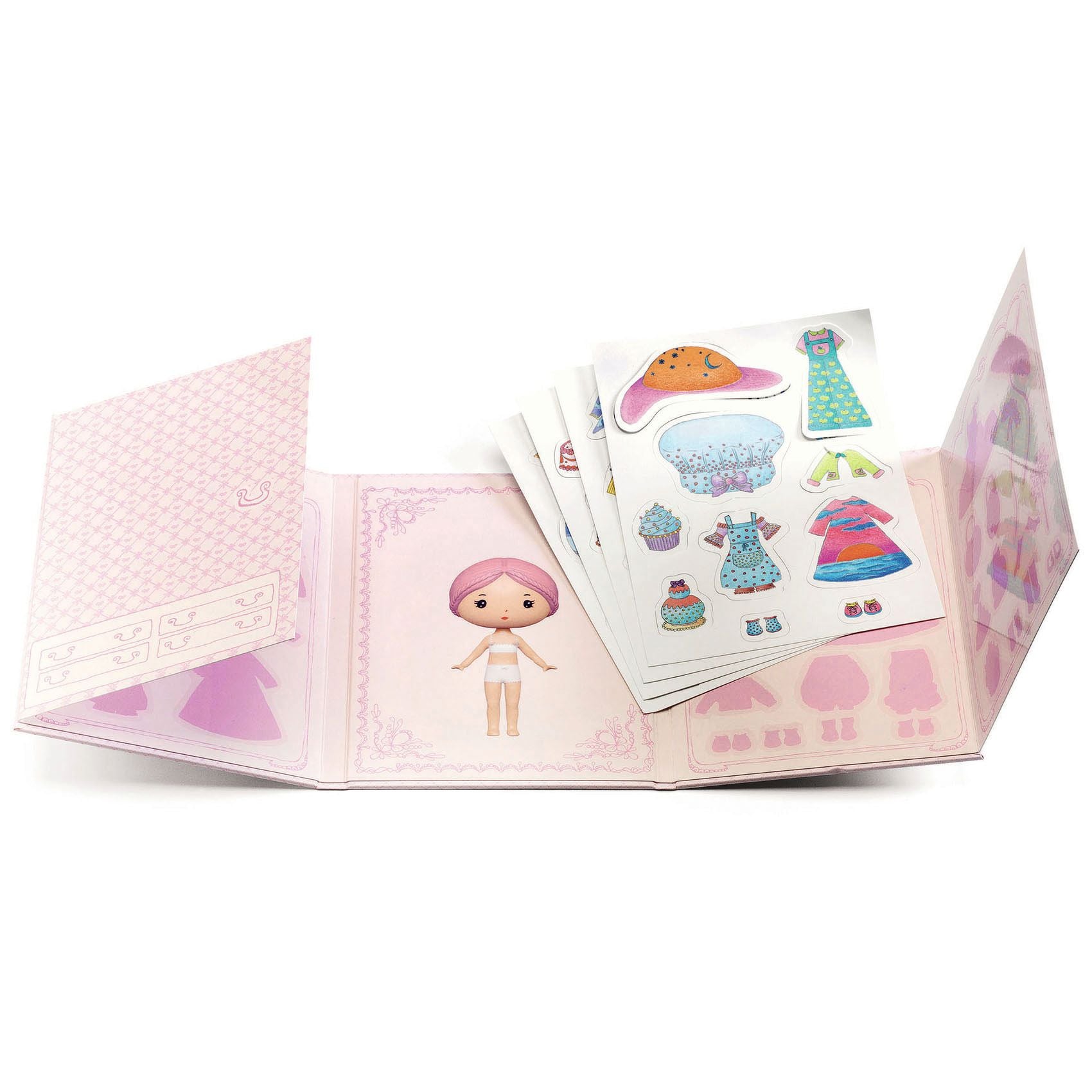 Open book with stickers featuring a doll and clothing items on a white background