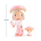 Toy figures with a pink mushroom hat and suitcase