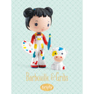 Toy figure of a girl with a cow on a light blue background with 'Barbouille & Gribbs' branding.