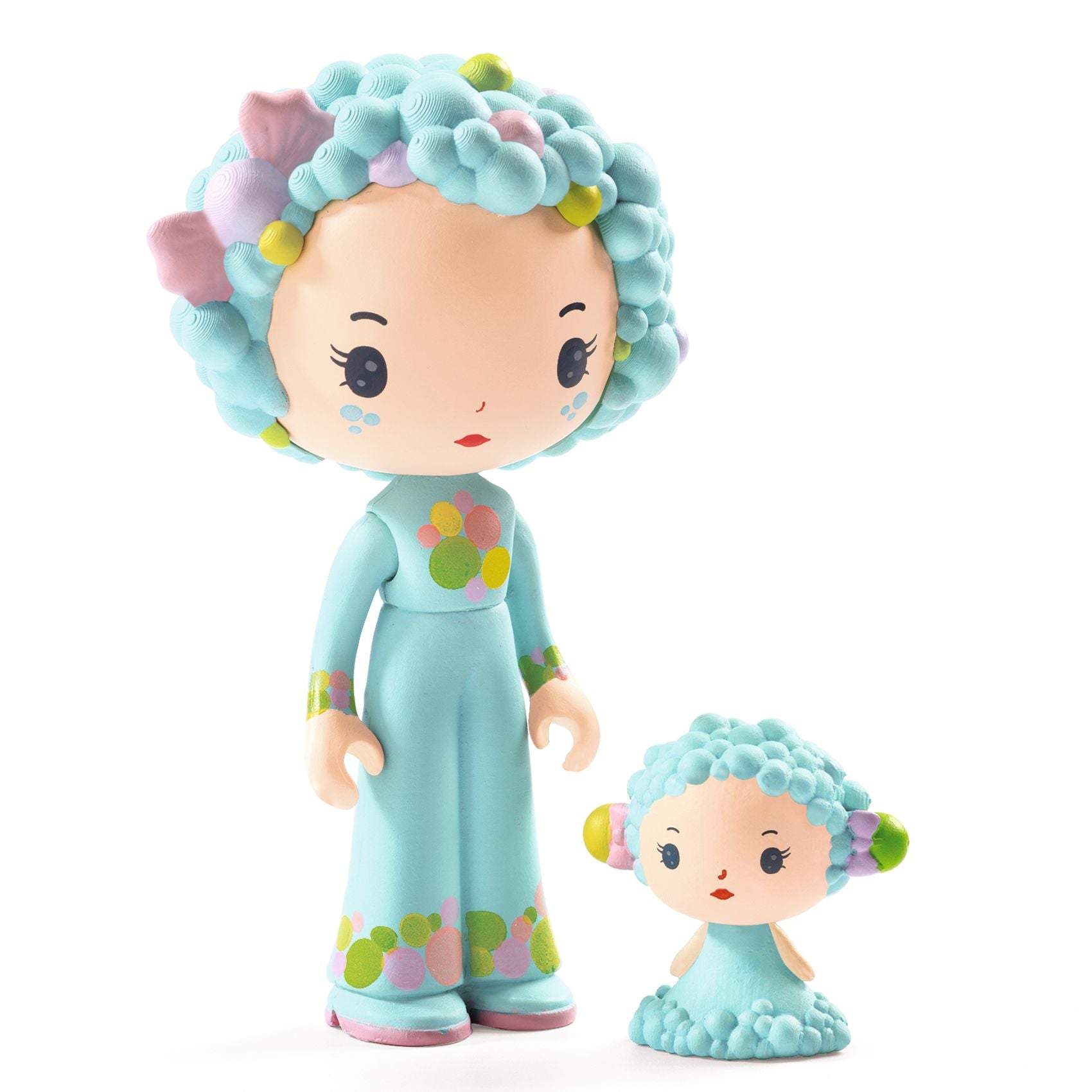 Two toy figurines with turquoise hair and dresses on a white background
