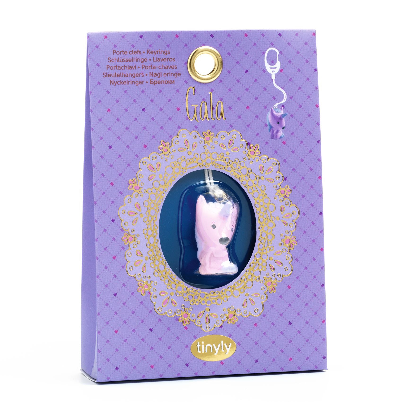 Purple packaging of a product with a pink dog-shaped item inside, featuring the brand 'tinlyly'.