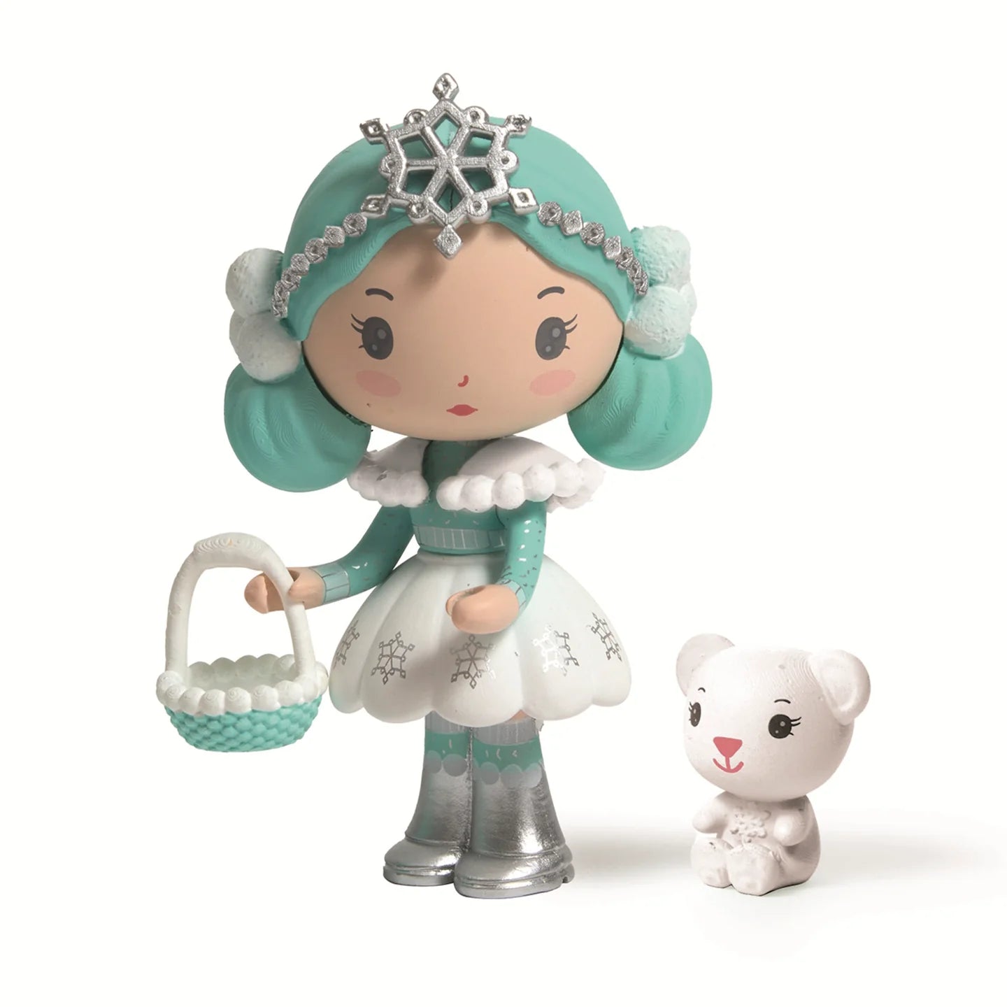 Toy figure of a girl with teal hair and snowflake crown, holding a basket, with a small white teddy bear beside her on a white background.