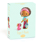 Box packaging of a toy figure with a pink headband and dog, featuring the brand 'tinyly'.