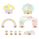 Set of pastel-colored mushroom-shaped decorations with a rainbow and cloud design on a white background.