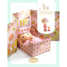Small doll in a decorative bed with 'Rose Tinyroom' and 'tinyly' branding.