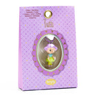 Purple packaging of a 'Tutti' necklace with a character figure inside, featuring the brand 'tinyly'.