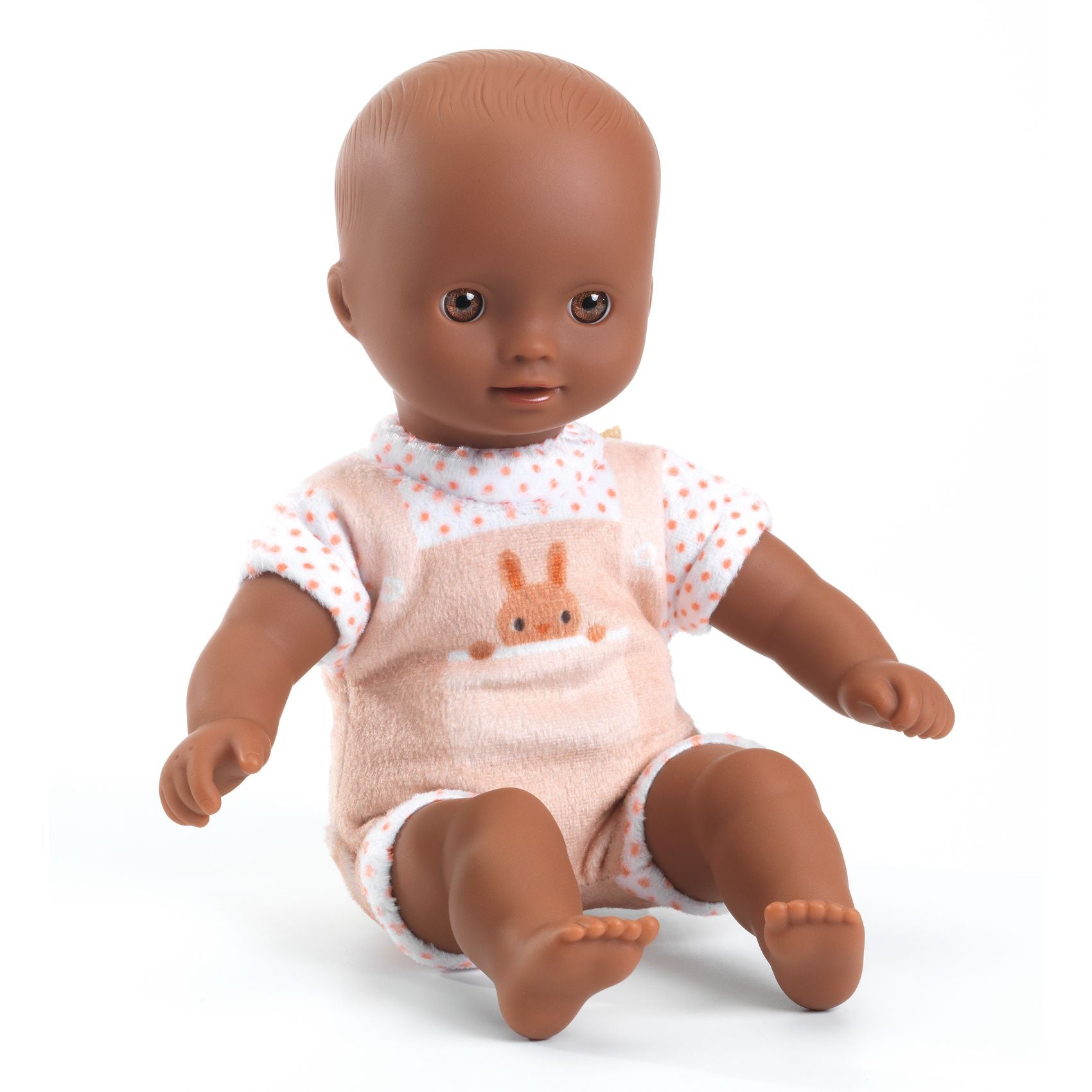 Baby doll with a pink outfit featuring a bunny design on a white background