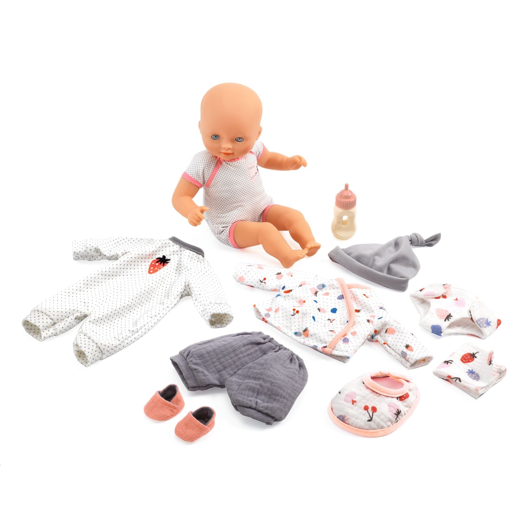 Baby doll with accessories including clothes, a bottle, and a hat on a white background