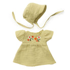 Yellow baby dress with floral embroidery and matching bonnet on a white background