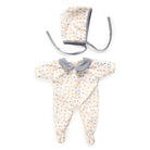 Baby onesie with floral pattern and matching bonnet on a white background