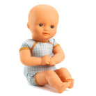 Baby doll with a checkered outfit on a white background