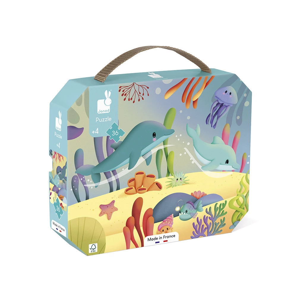 Colorful puzzle box with underwater theme featuring dolphins and sea creatures on a white background
