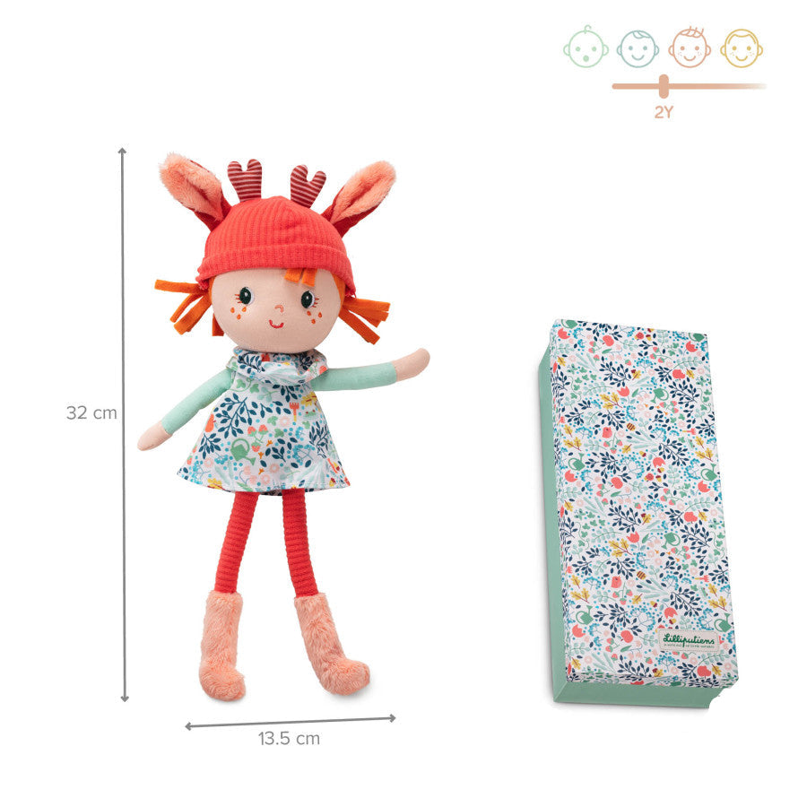 Stuffed soft doll toy with detachable hat and floral packaging on a white background