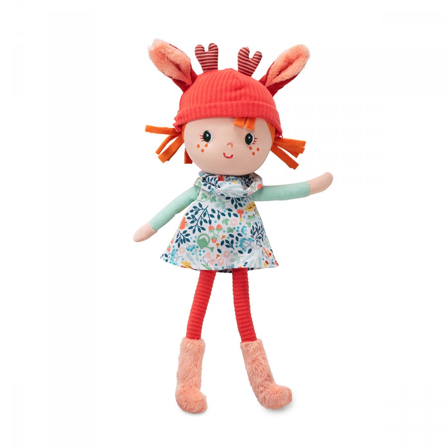 soft rag doll with red hat and floral dress on a white background