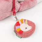 Pink coin purse with unicorn design and rainbow accents on a white background