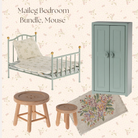 Maileg miniature dollhouse bedroom furniture bundle featuring a light blue metal single bed with floral bedding, a matching light blue double-door wardrobe, two wooden stools, and a floral rug on a pale floral patterned background.