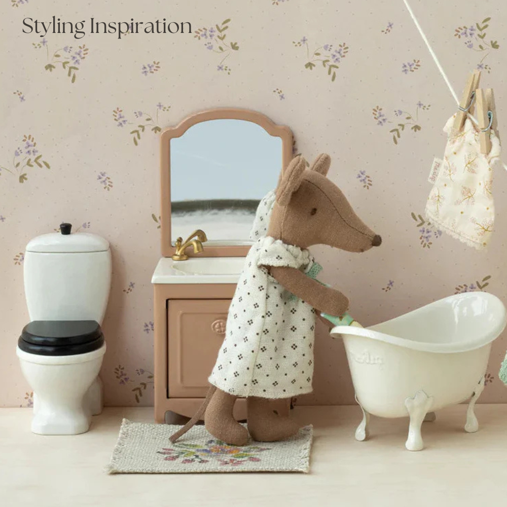 Stylized bathroom scene with a toy kangaroo, bathtub, and vanity mirror.
