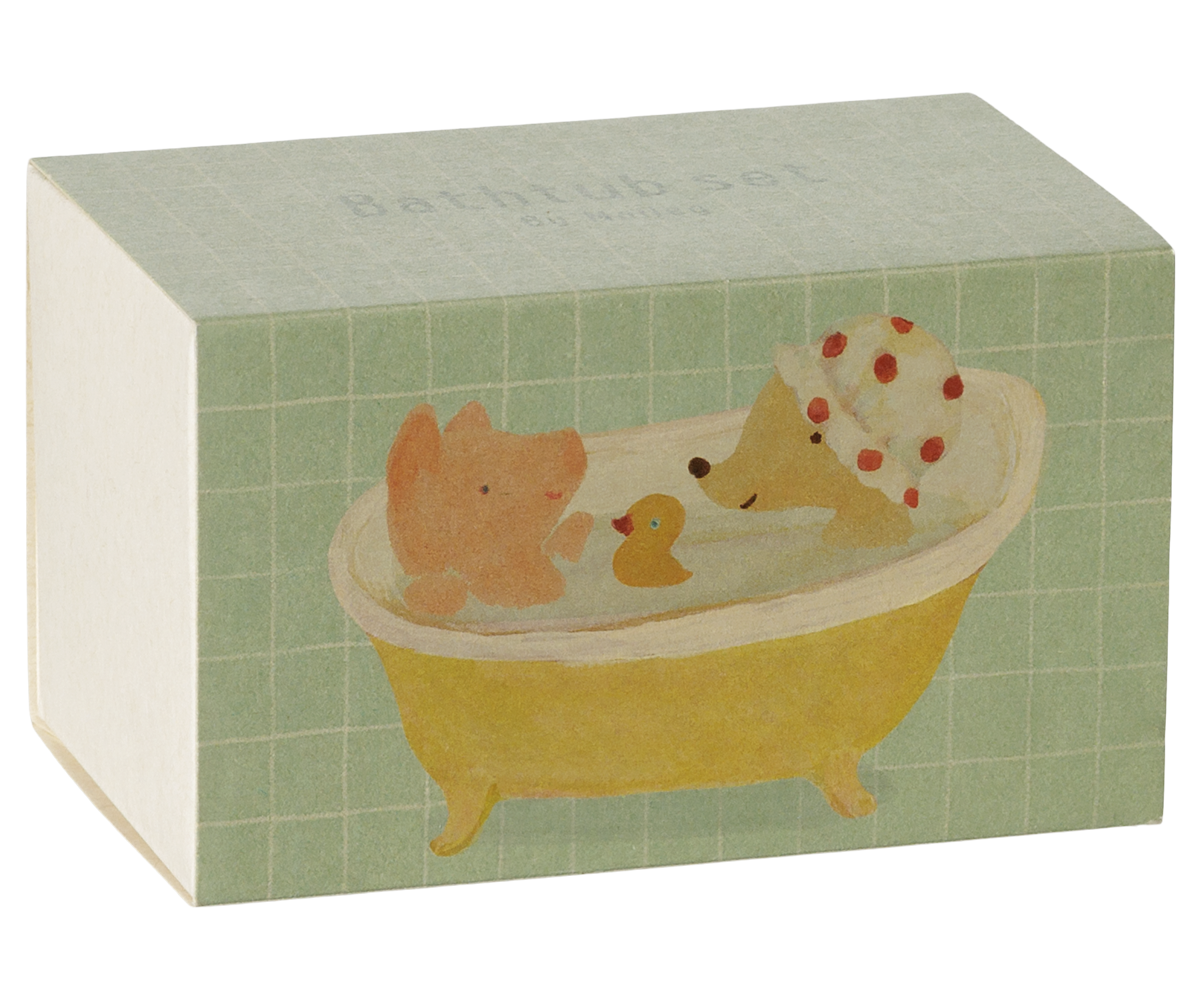 A rectangular product box for a 'Bath Tub Set' by Maileg, featuring a light green tiled pattern and an illustration of a yellow bathtub with a pink pig, a yellow duck, and a beige dog wearing a red-and-white polka dot bath cap.
