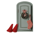 A miniature dollhouse-style gray door decorated with a green wreath, candy cane, and a red-and-white striped stocking, with two small red boot shapes beside it on a white background.