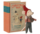 A vintage-style children's book titled 'Christmas Tales: Bedtime Stories' with an illustrated snowman and child on the cover, shown next to a small plush mouse doll wearing a red hat, plaid scarf, and gray pants on a white background.