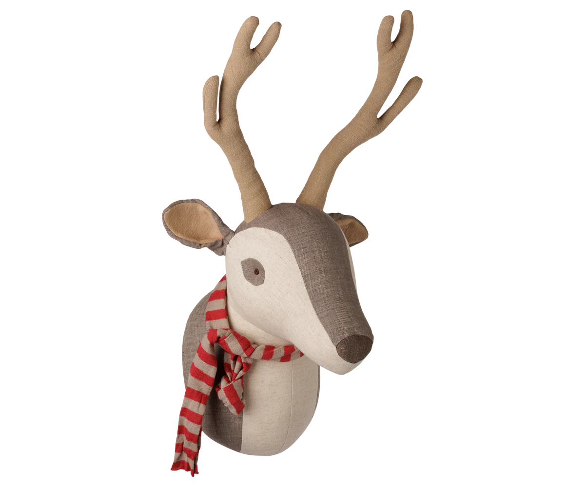 A fabric reindeer head wall decor piece with tan antlers, a brown and cream face, and a red and white striped scarf, isolated on a white background.