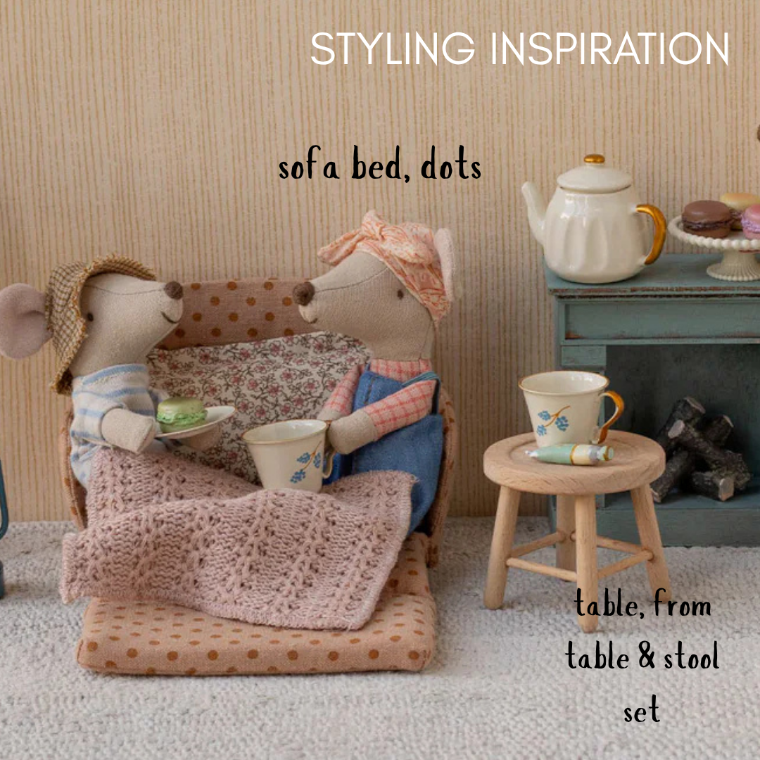 Two toy mice on a miniature sofa with a teapot and cup, styled as 'Styling Inspiration' for a 'sofa bed, dots' and 'table, from table & stool set'.