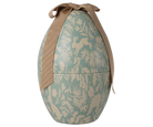 Decorative Easter egg with rabbit and leaf pattern and brown ribbon on a white background
