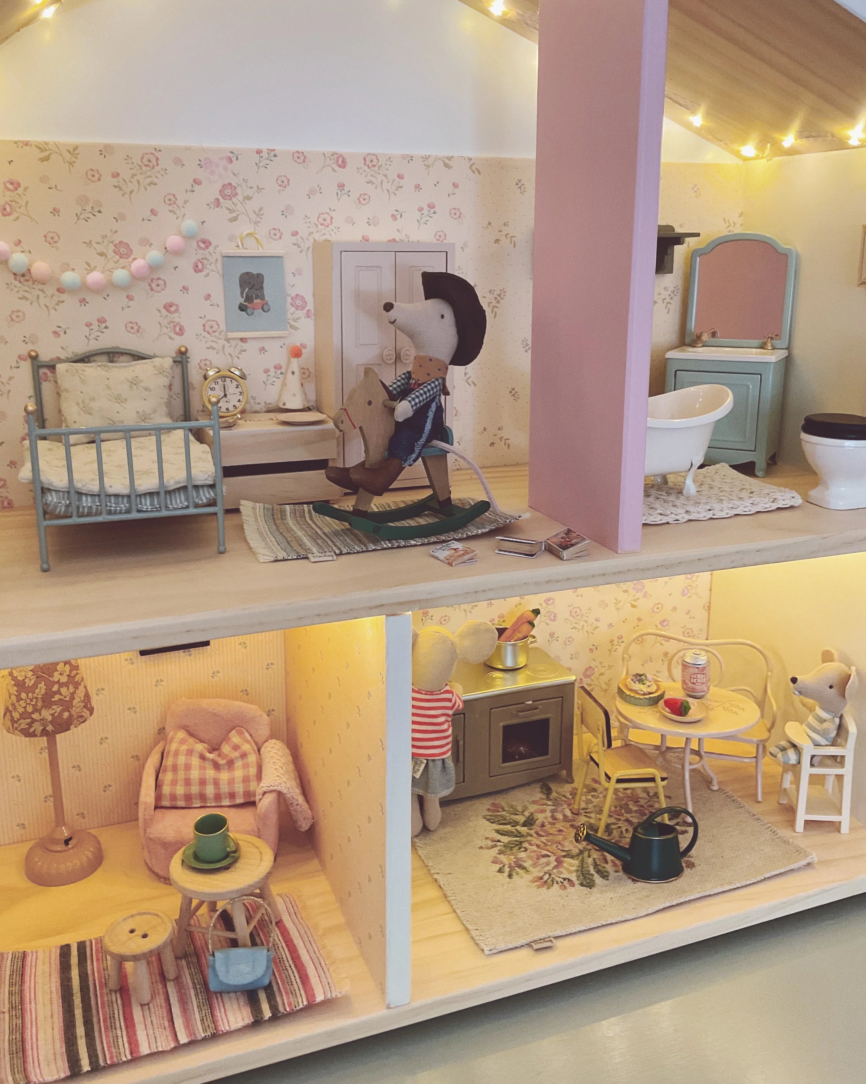 Detailed dollhouse with miniature furniture and decor