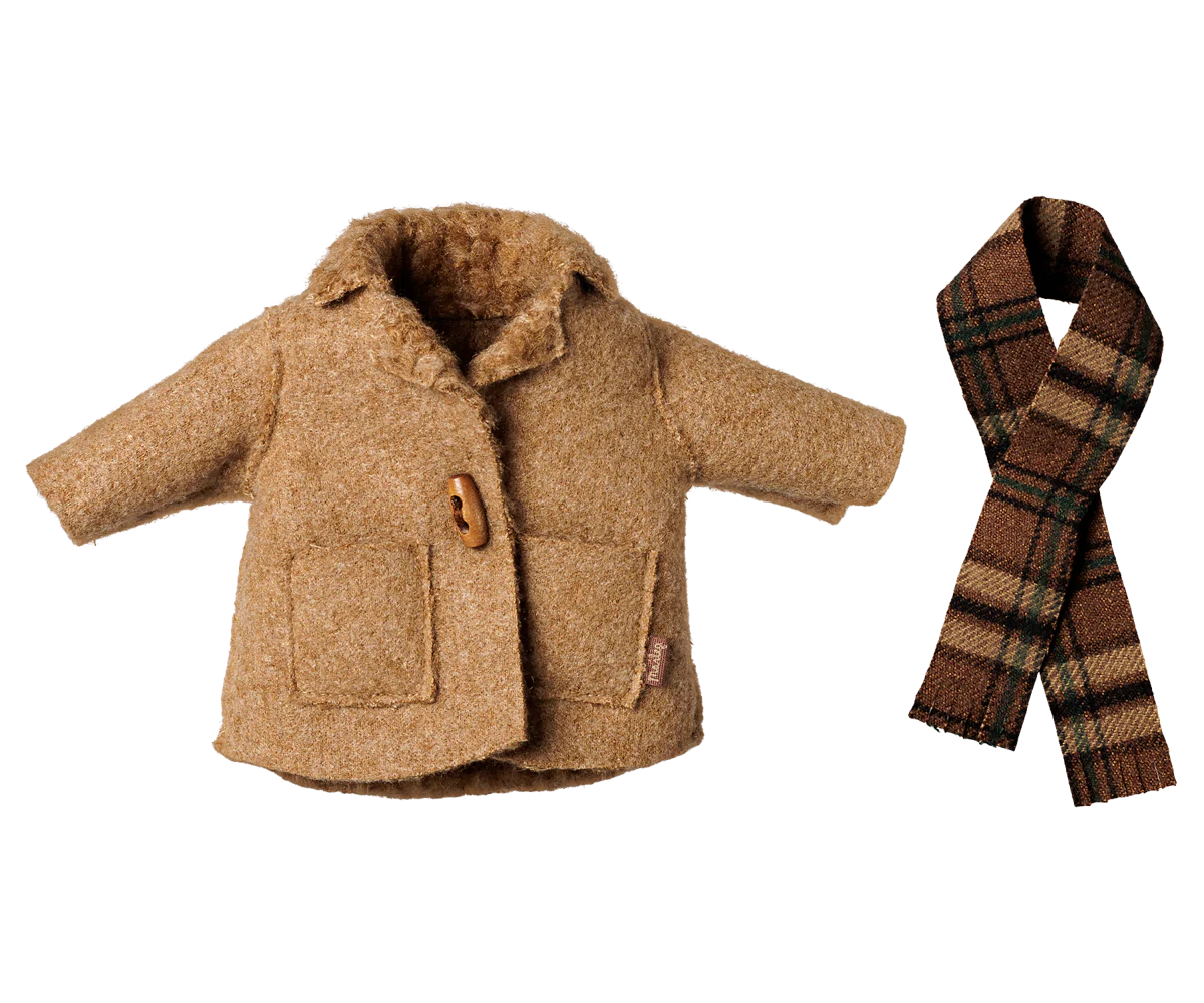 A miniature brown wool coat with faux fur trim and a wooden button, shown next to a matching brown and beige plaid scarf on a white background.