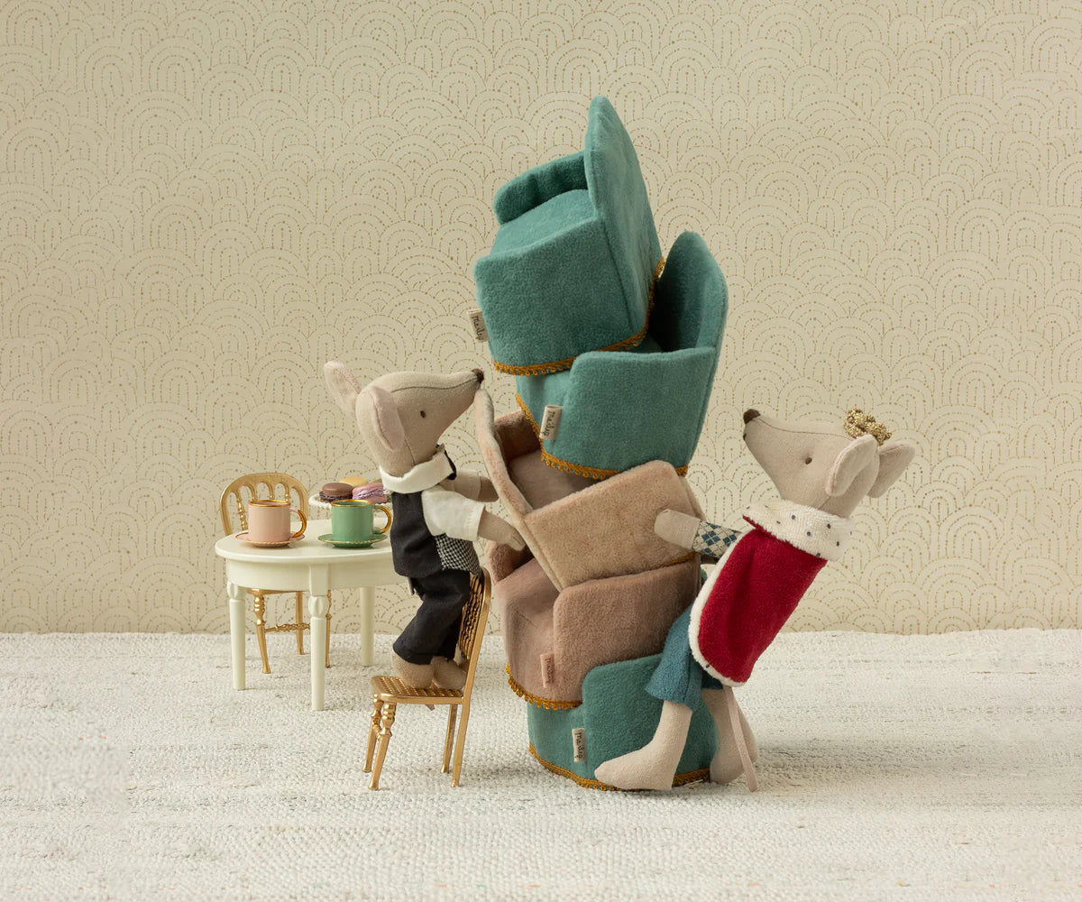 maileg king mouse with Stack of plush chairs with animal figures on a neutral background